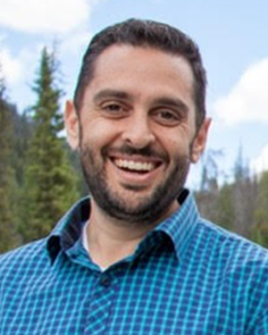 Man with blue shirt smiling